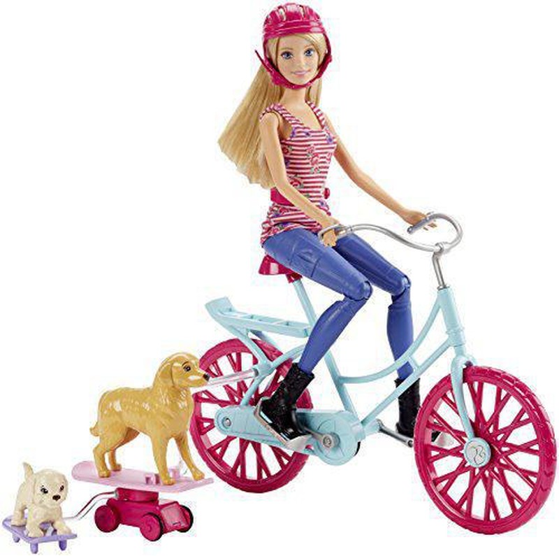 Barbie en bicicleta store con perritos